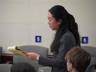 student with notebook